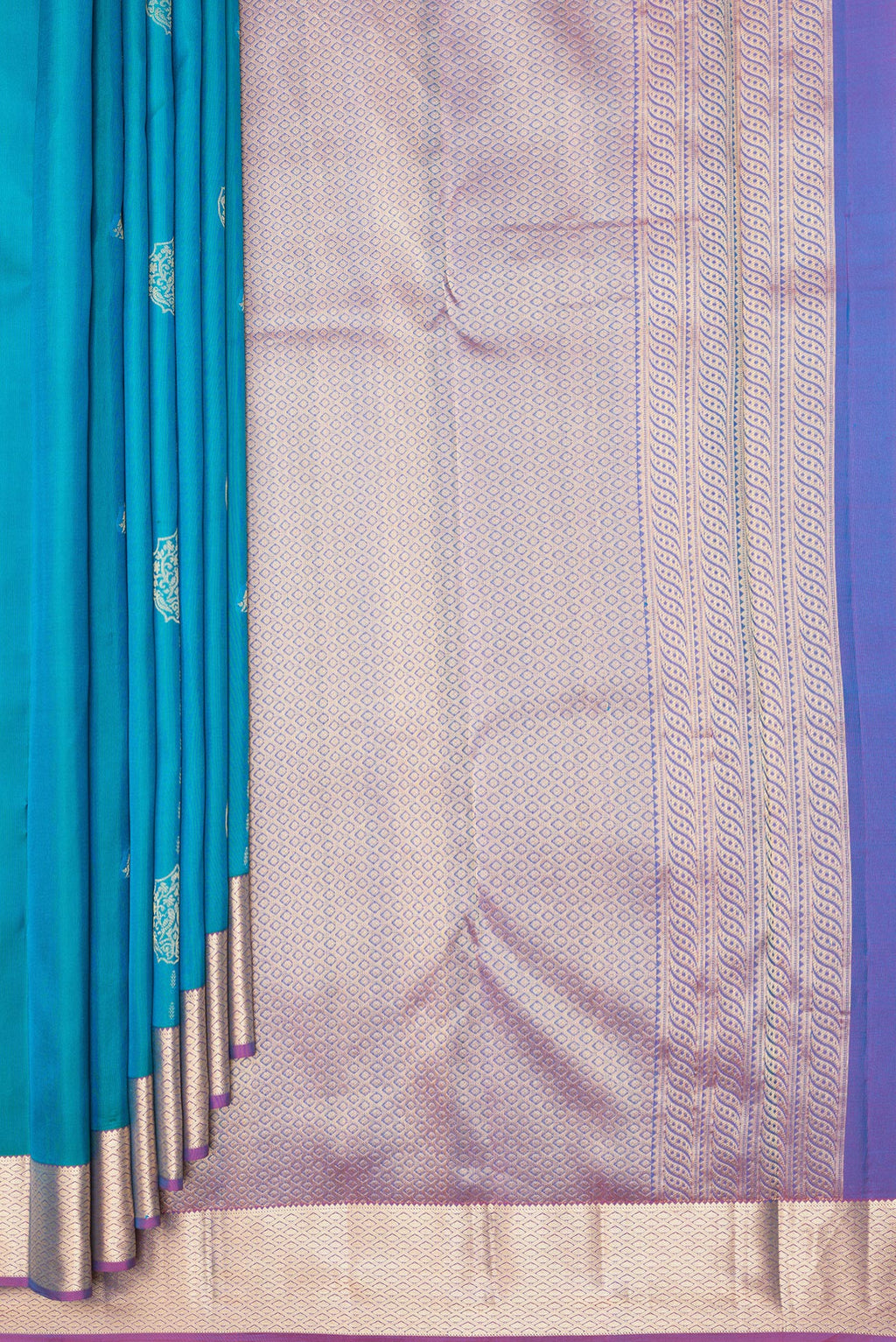 Pleats and pallu of Pure Silk Peacock Blue Kanchipuram Saree with Zari Butta on the body and Zari Border. 