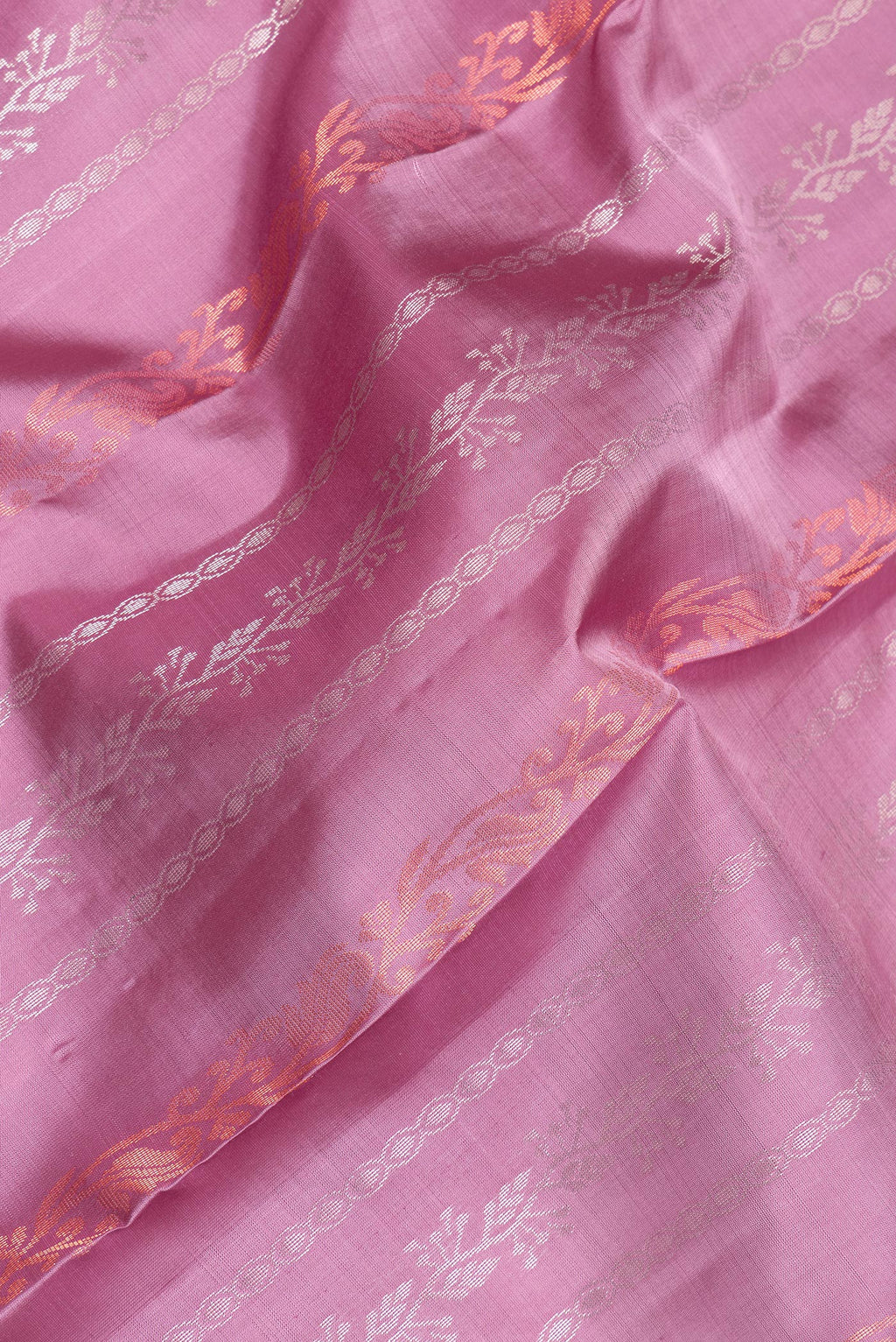 Close up of Pure Silk Pink Kanchipuram Saree with Stripes on the body and Fancy Border.  displaying folds