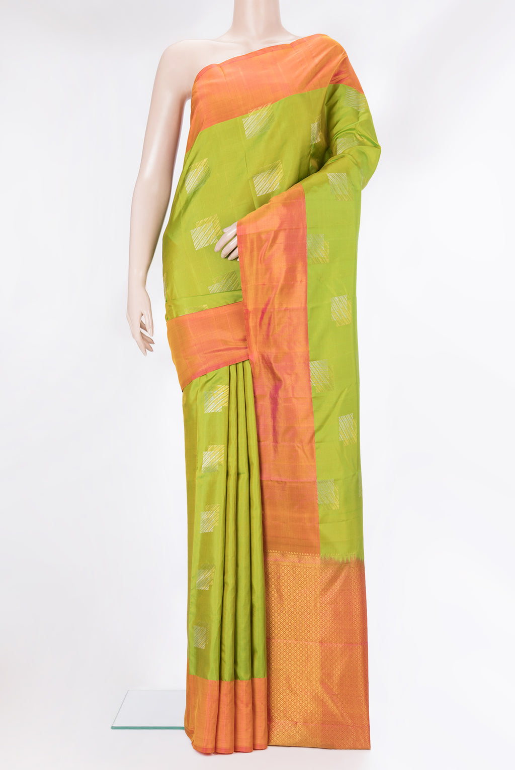 Pure Silk Parrot Green Kanchipuram Saree with Zari Butta on the body and Plain Border.  displayed on a mannequin