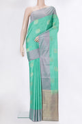 Pure Silk Sea Green Dual Tone Kanchipuram Saree with Zari Butta on the body and Plain Border.  displayed on a mannequin