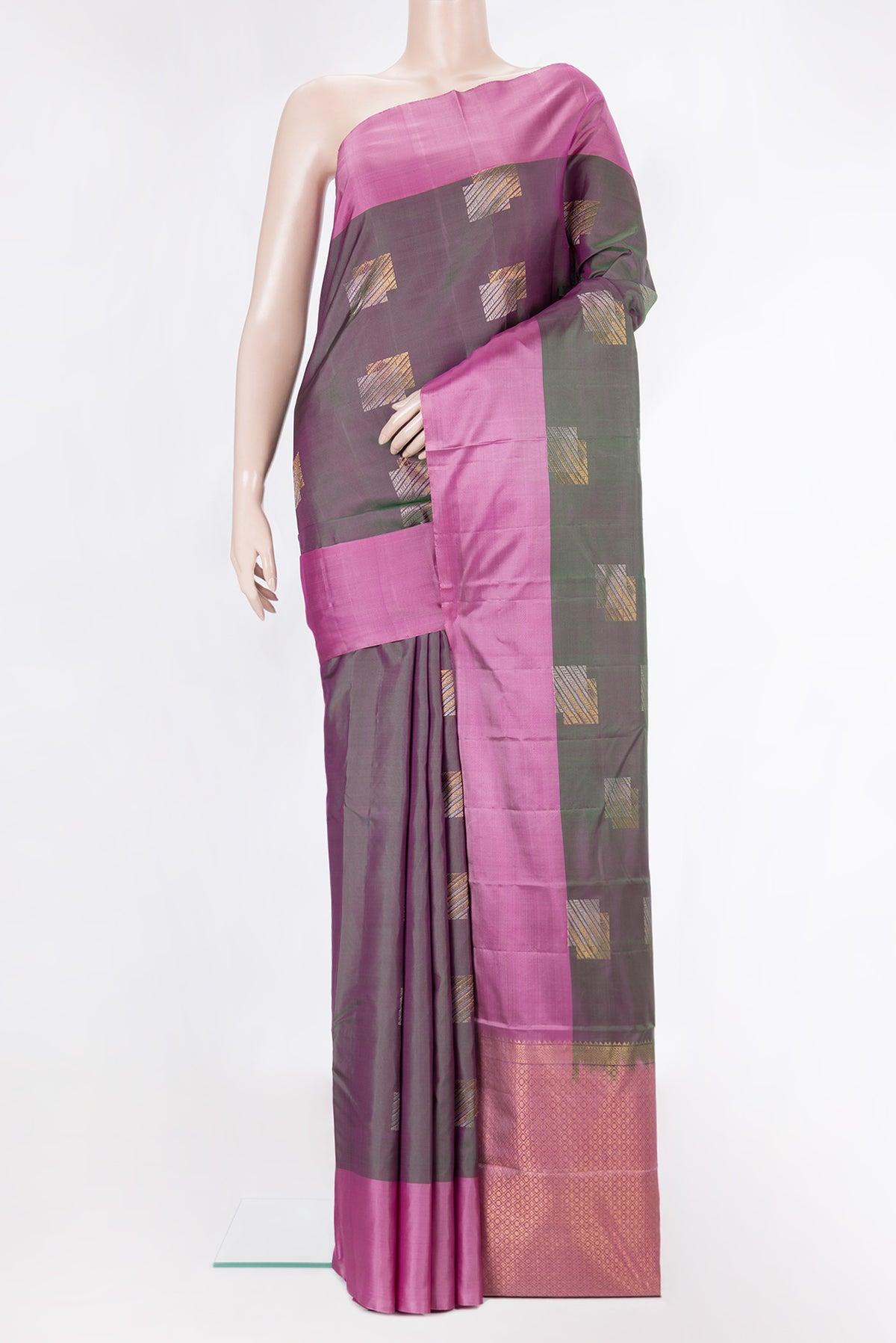 Pure Silk Green Dual Tone Kanchipuram Saree with Zari Butta on the body and Plain Border.  displayed on a mannequin