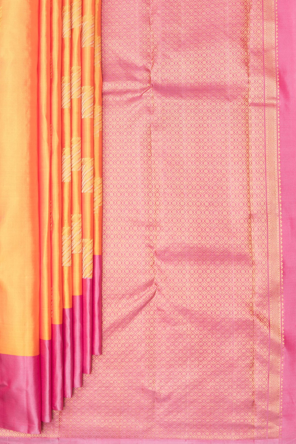 Pleats and pallu of Pure Silk Mustard Kanchipuram Saree with Zari Butta on the body and Plain Border. 