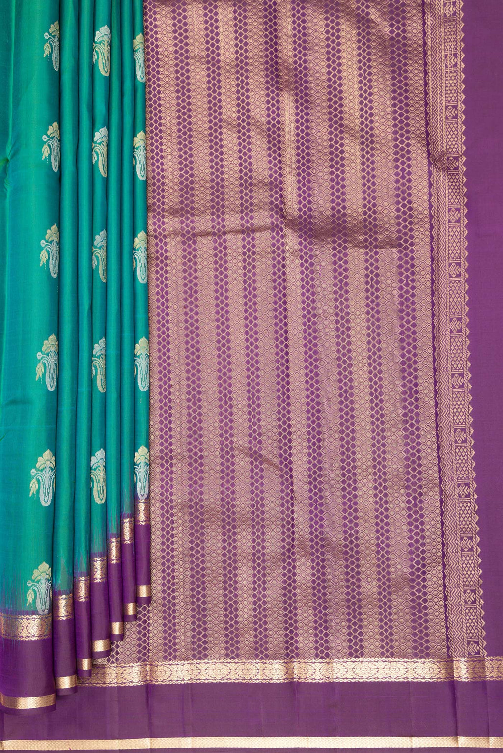 Pleats and pallu of Pure Silk Green Kanchipuram Saree with Zari Butta on the body and Zari Border. 