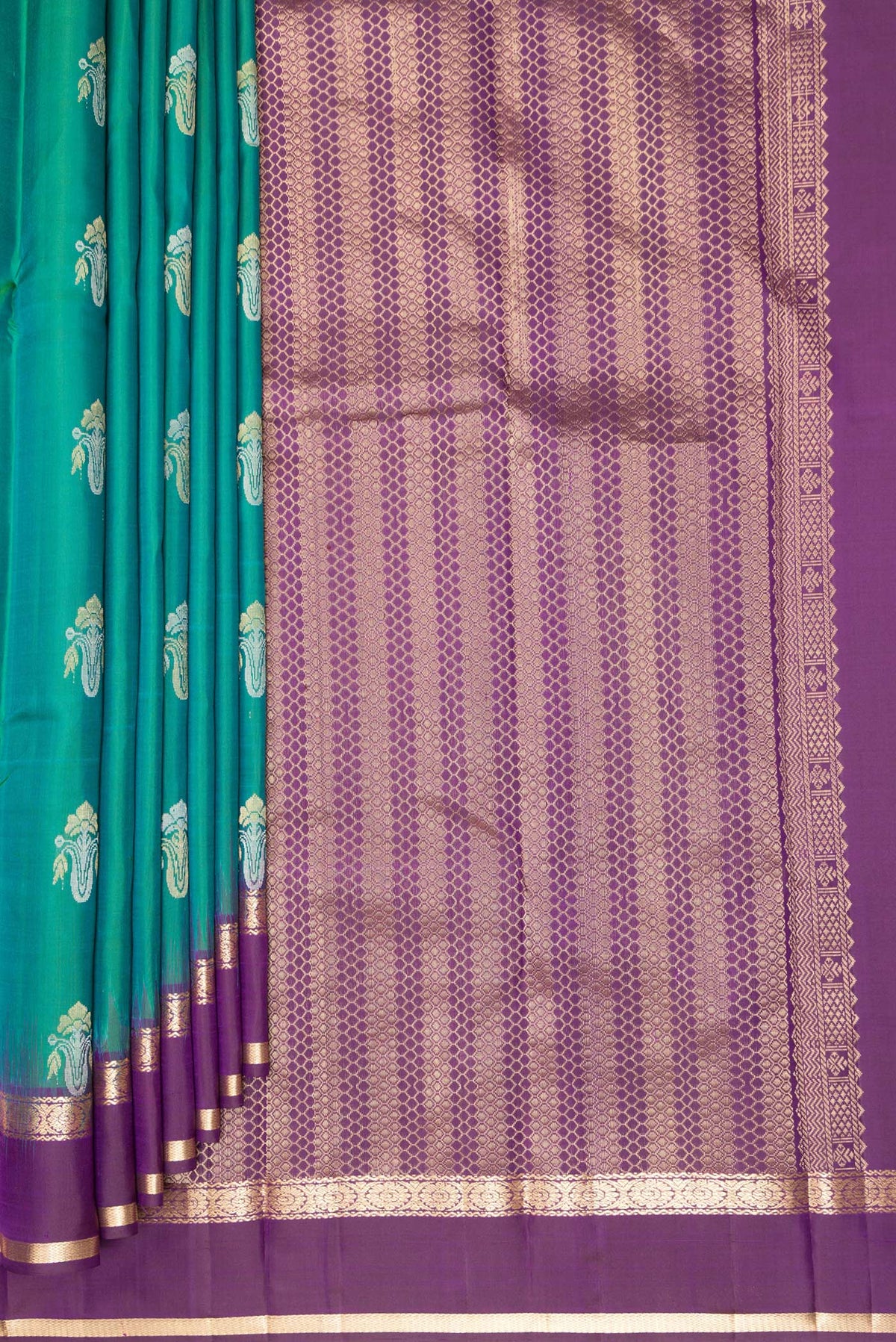 Pleats and pallu of Pure Silk Green Kanchipuram Saree with Zari Butta on the body and Zari Border. 