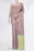 Pure Silk Rose Gold Kanchipuram Saree with Zari Butta on the body and Without Border.  displayed on a mannequin