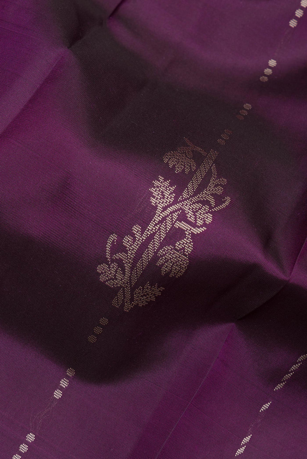 Close up of Pure Silk Purple Kanjivaram Saree with Thread Butta on the body and Thread Border.  displaying folds