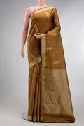 Pure Silk Brown Kanjivaram Saree with Thread Butta on the body and Thread Border.  displayed on a mannequin
