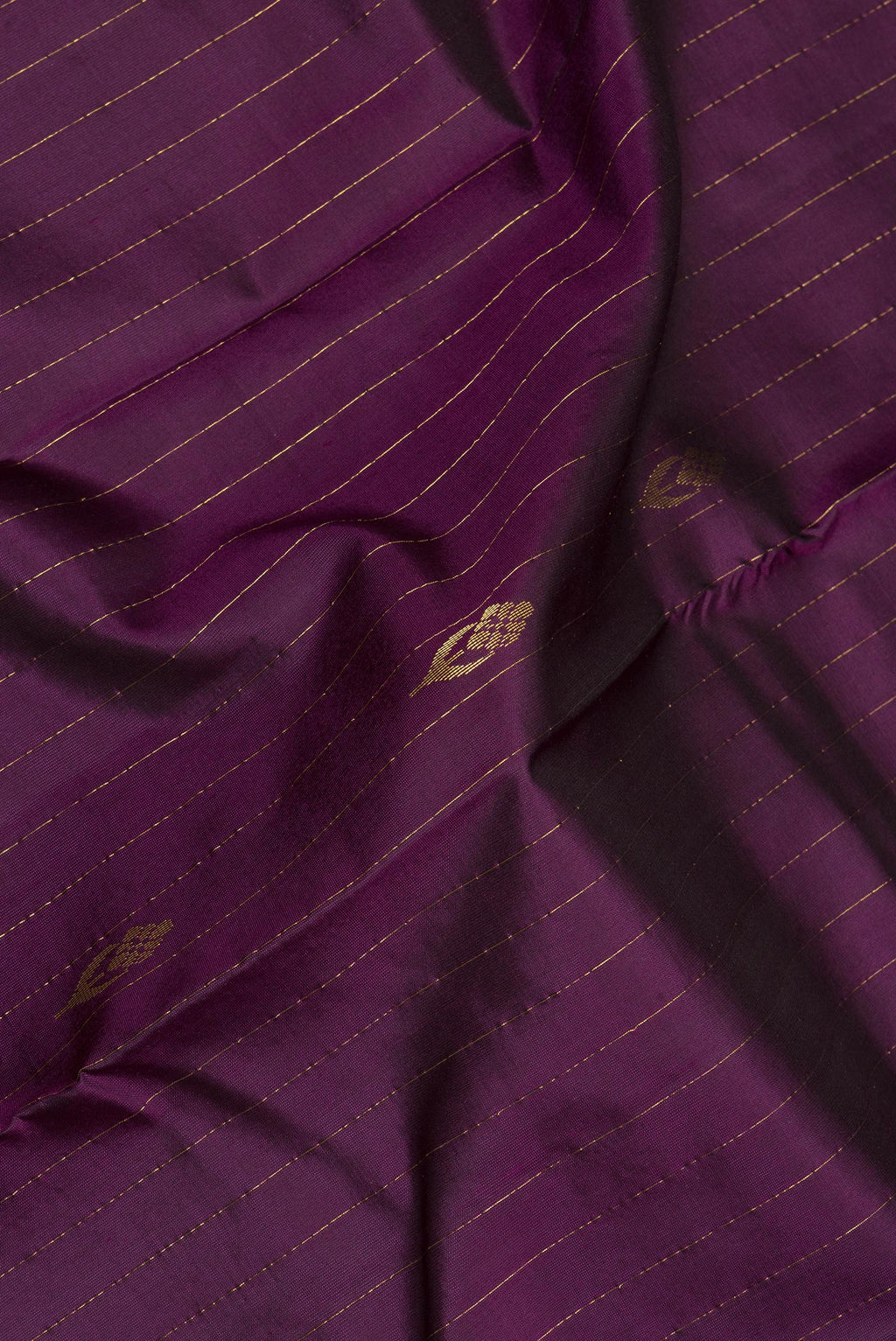 Close up of Pure Silk Purple Kanchipuram Saree with Stripes on the body and Plain Border.  displaying folds