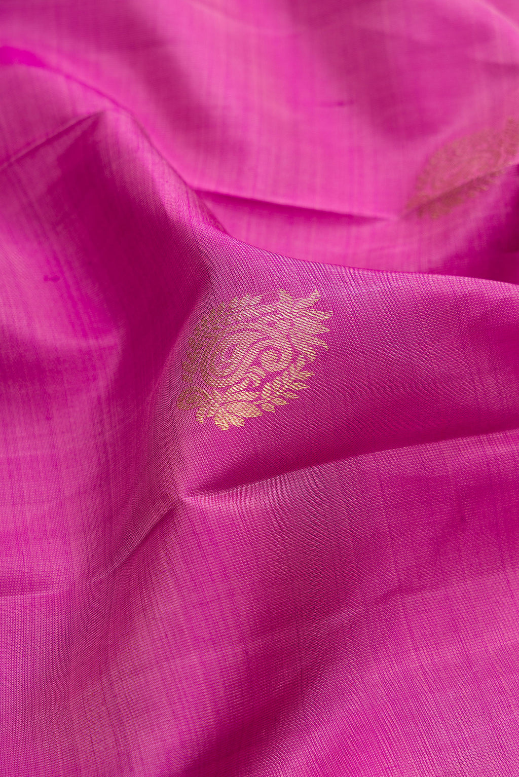 Close up of Pure Silk Light Magenta Kanjivaram Saree with Zari Butta on the body and Zari Border.  displaying folds