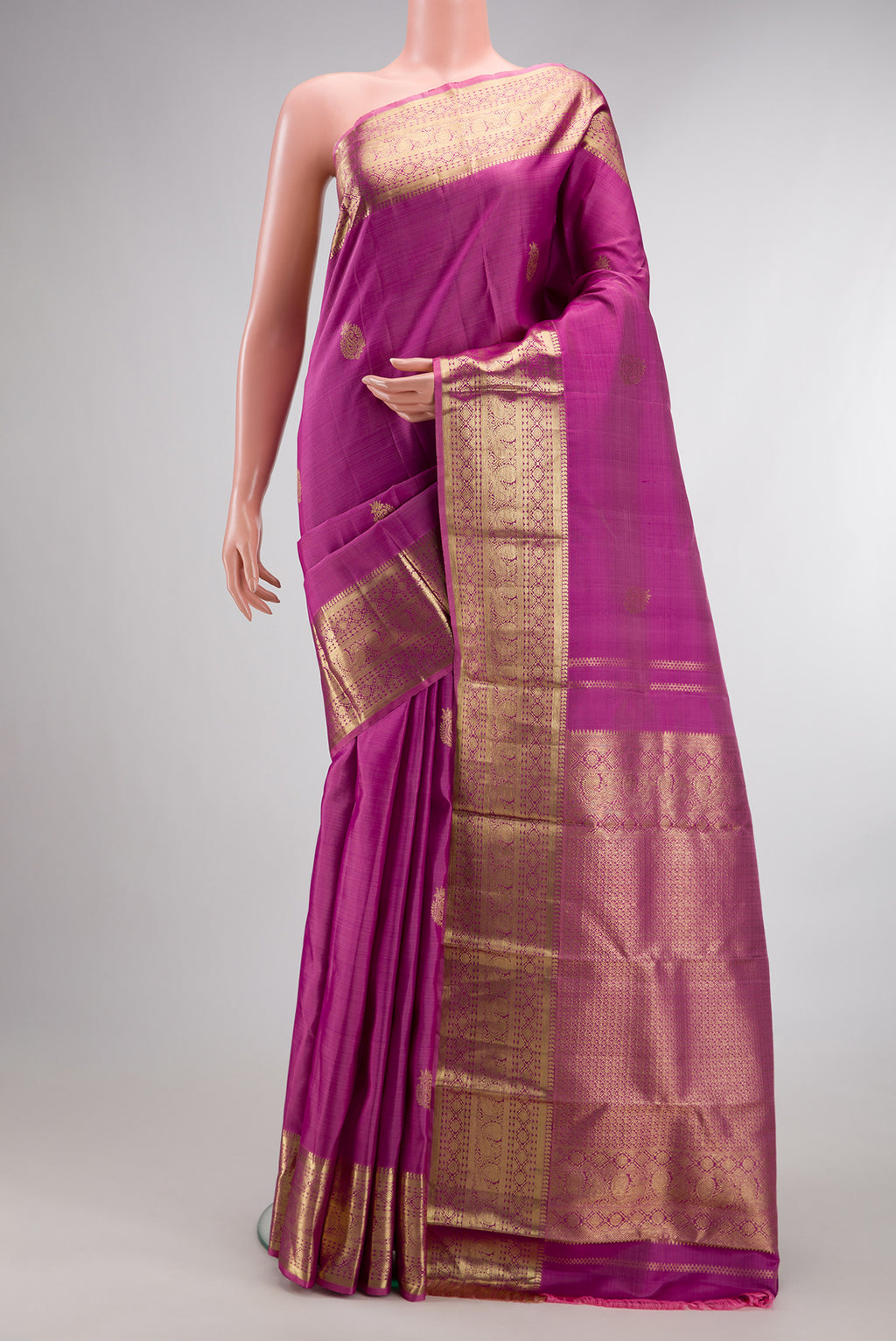 Pure Silk Light Magenta Kanjivaram Saree with Zari Butta on the body and Zari Border.  displayed on a mannequin