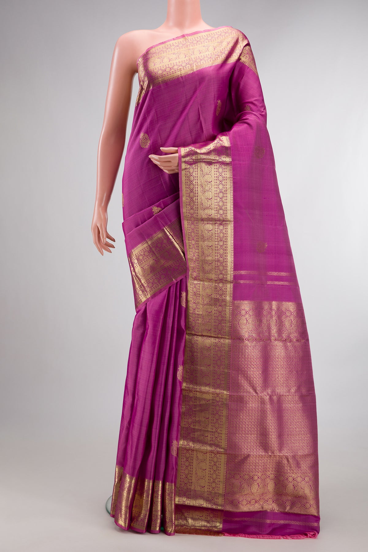 Pure Silk Light Magenta Kanjivaram Saree with Zari Butta on the body and Zari Border.  displayed on a mannequin