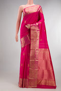 Pure Silk Pink Kanjivaram Saree with Zari Butta on the body and Zari Border.  displayed on a mannequin