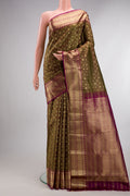 Pure Silk Mehandi Green Kanchipuram Saree with Zari Brocade on the body and Fancy Border.  displayed on a mannequin