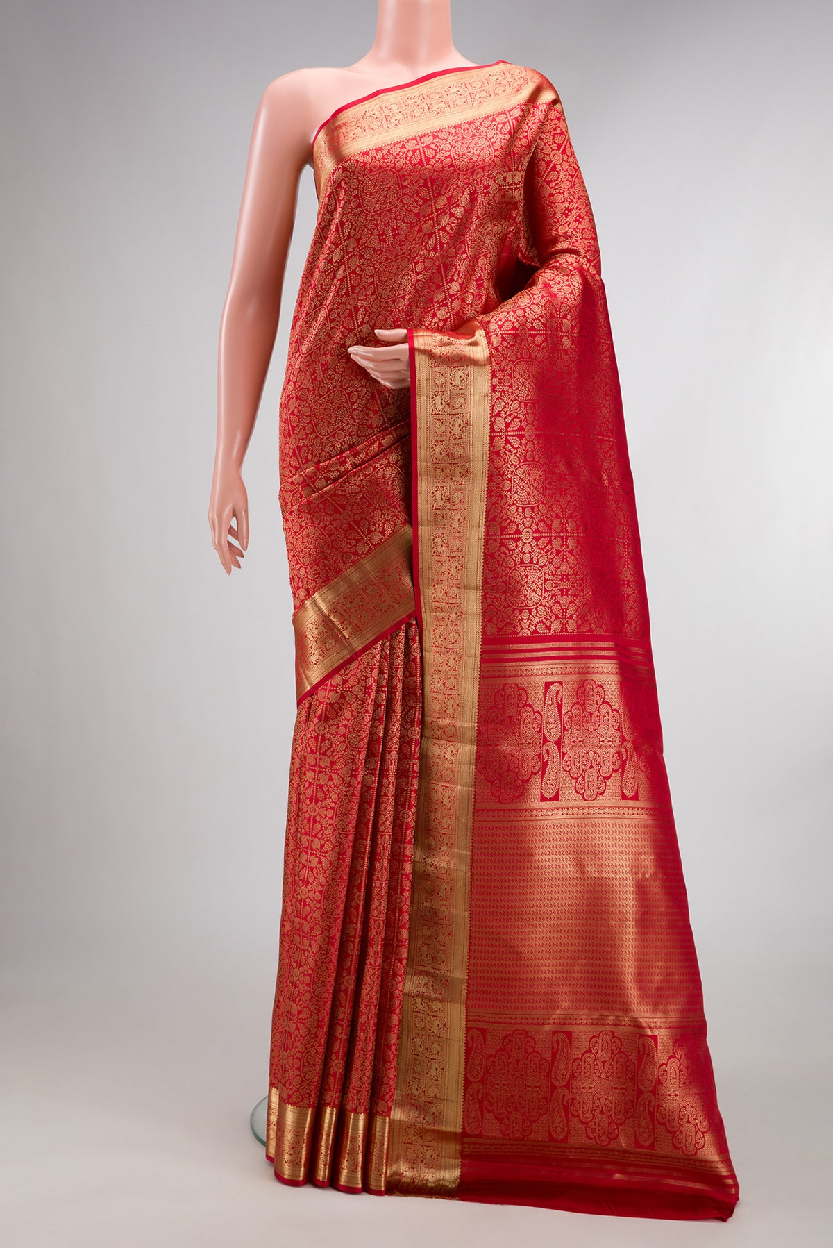 Pure Silk Red Kanchipuram Saree with Zari Brocade on the body and Zari Border.  displayed on a mannequin