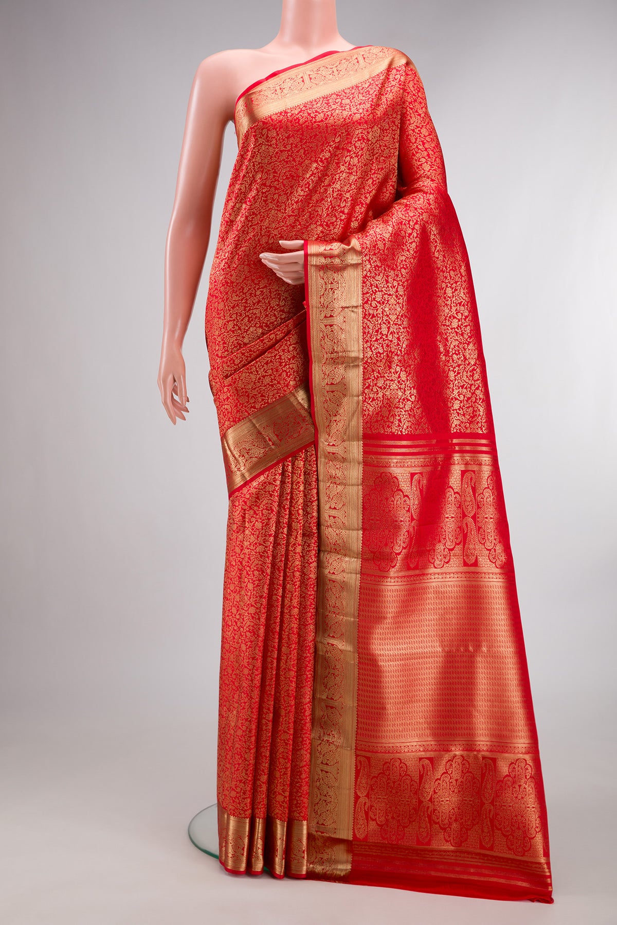 Pure Silk Red Dual Tone Kanchipuram Saree with Zari Brocade on the body and Zari Border.  displayed on a mannequin