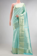 Pure Silk Light Blue Dual Tone Kanchipuram Saree with Zari Brocade on the body and Zari Border.  displayed on a mannequin