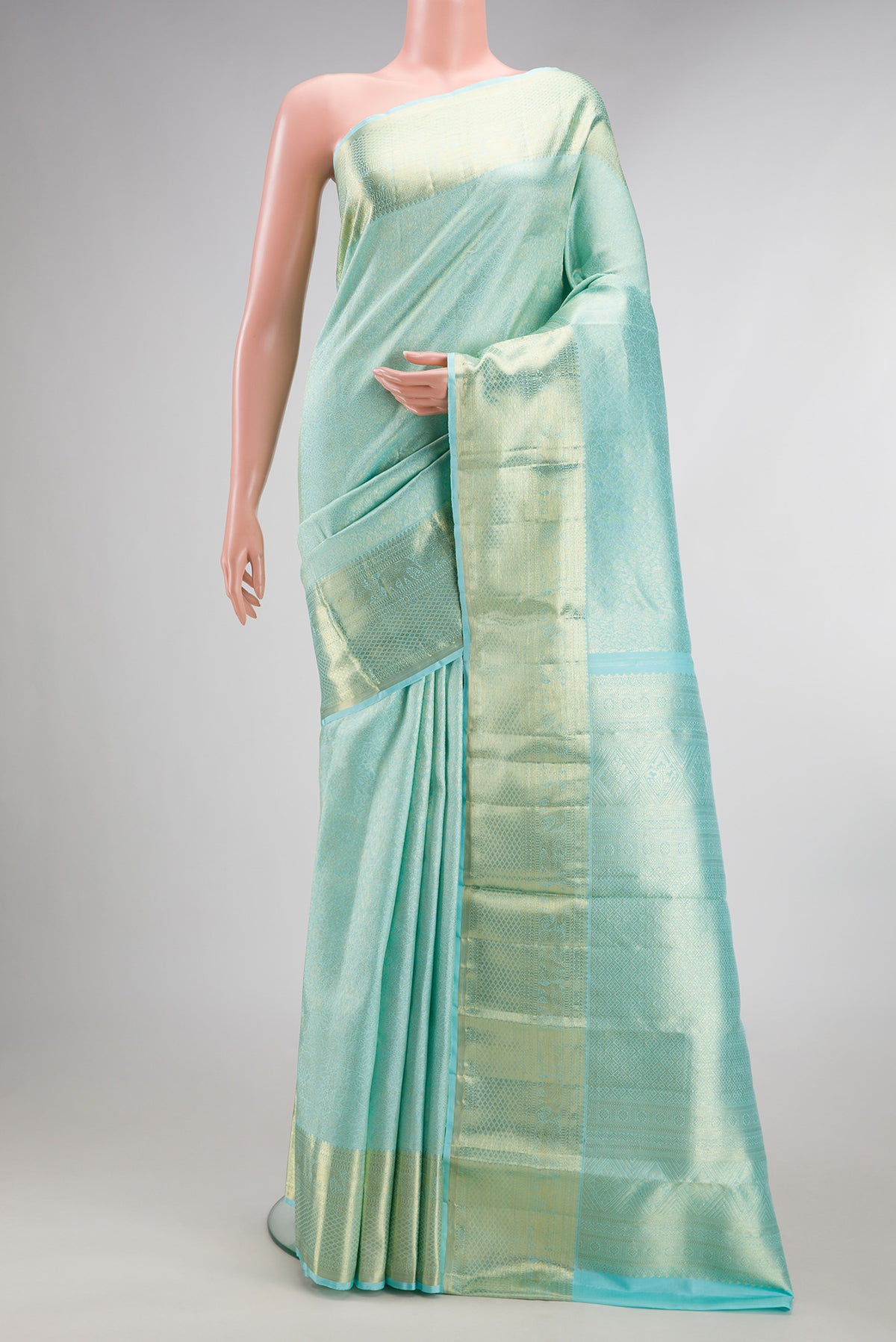 Pure Silk Light Blue Dual Tone Kanchipuram Saree with Zari Brocade on the body and Zari Border.  displayed on a mannequin