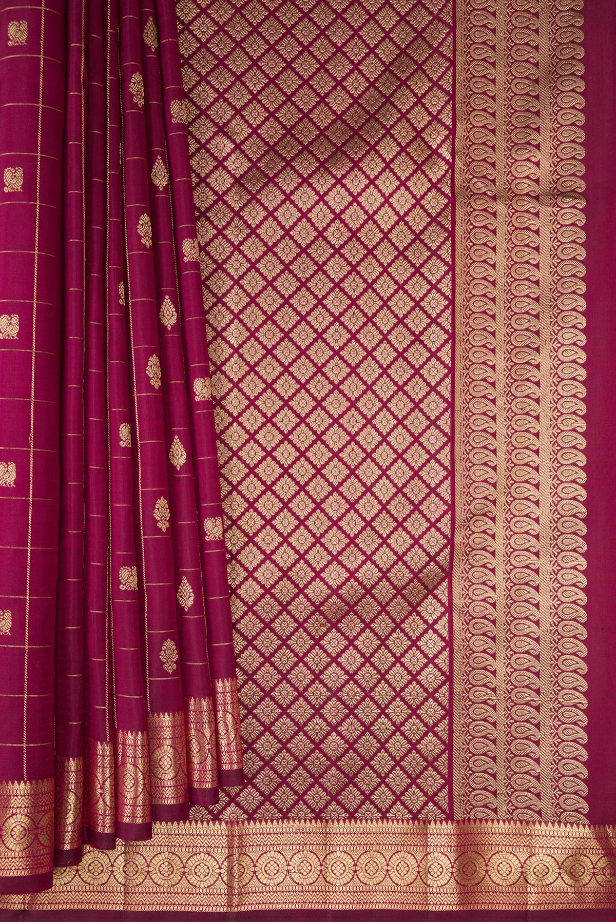 Pleats and pallu of Pure Silk Maroon Kanchipuram Saree with Checked design on the body and Zari Border. 