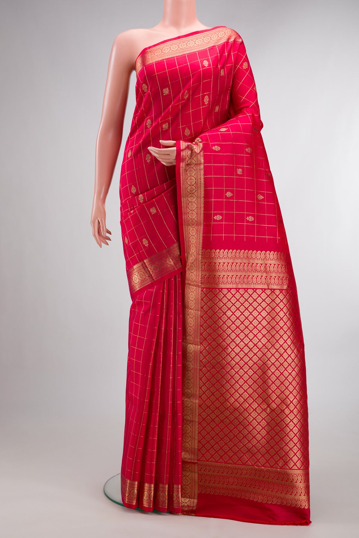 Pure Silk Dark Pink Dual Tone Kanchipuram Saree with Checked design on the body and Zari Border.  displayed on a mannequin