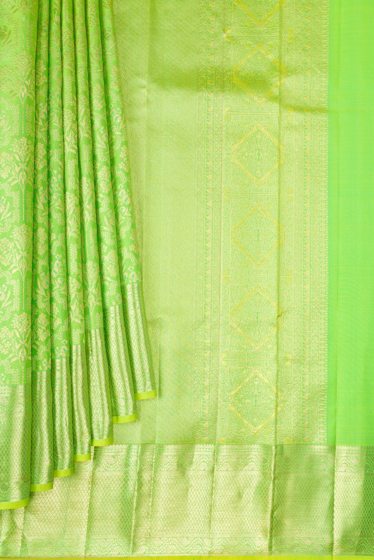 Pleats and pallu of Pure Silk Parrot Green Kanchipuram Saree with Zari Brocade on the body and Fancy Border. 