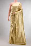 Gold with Red Dual Tone Kanjivaram Tissue Saree with Zari Brocade on the body and Fancy Border.  displayed on a mannequin