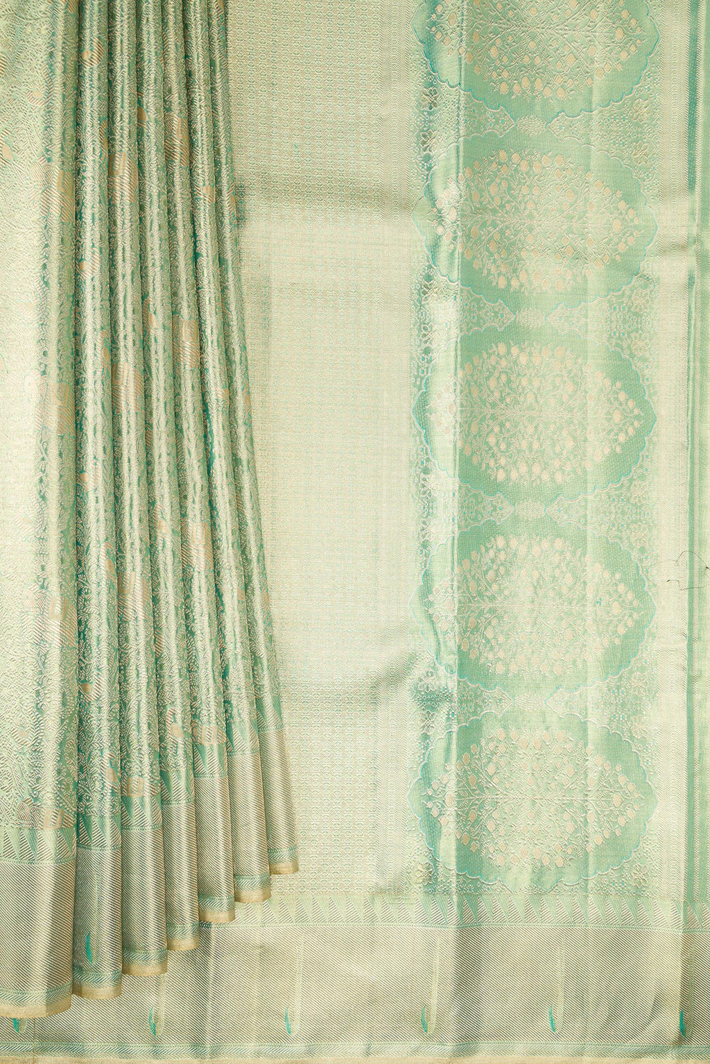 Pleats and pallu of Pista Green Dual Tone Kanjivaram Tissue Saree with Zari Brocade on the body and Fancy Border. 