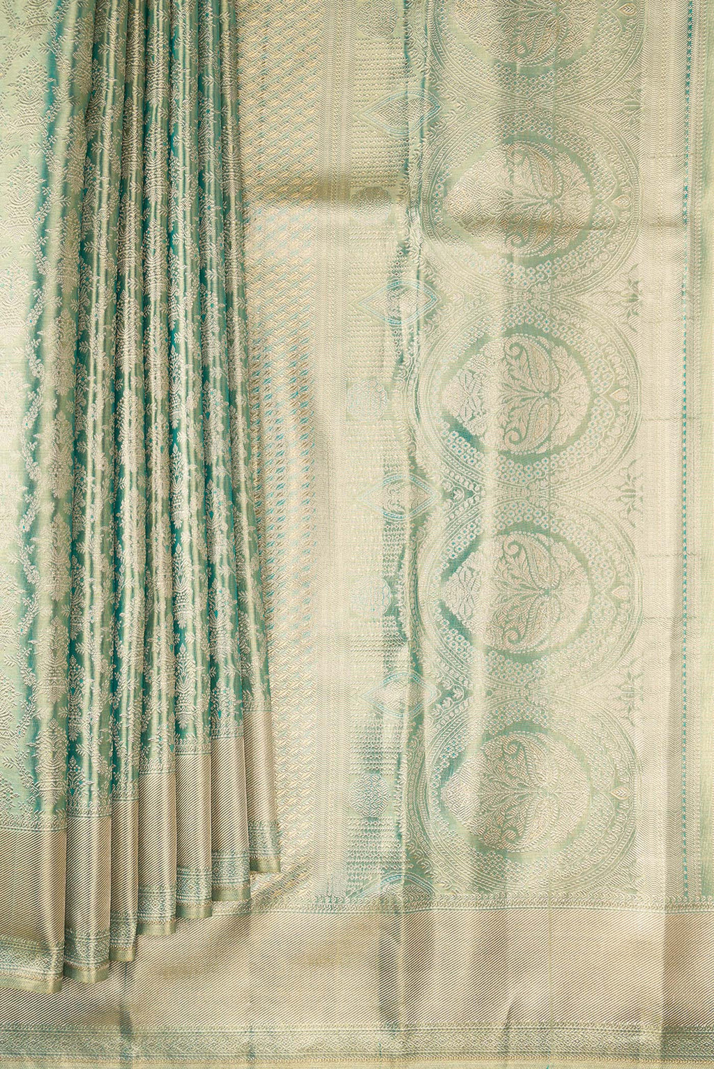 Pleats and pallu of Light Green Dual Tone Kanjivaram Tissue Saree with Zari Brocade on the body and Fancy Border. 