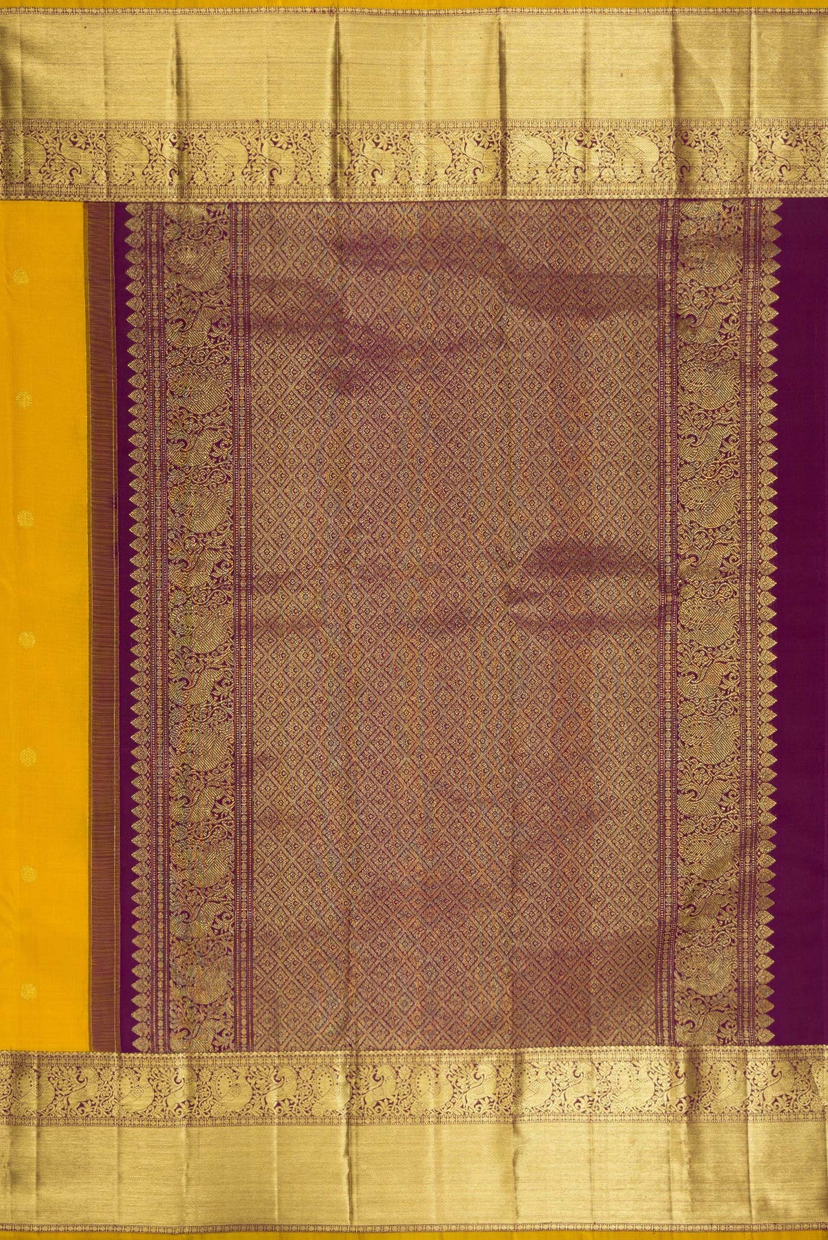 Close up image of the pallu of Pure Silk Mustard Kanjivaram Saree with Zari Butta on the body and Zari Border. 