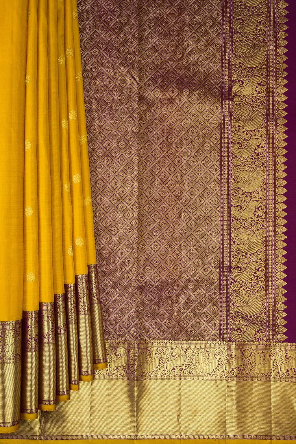 Pleats and pallu of Pure Silk Mustard Kanjivaram Saree with Zari Butta on the body and Zari Border. 