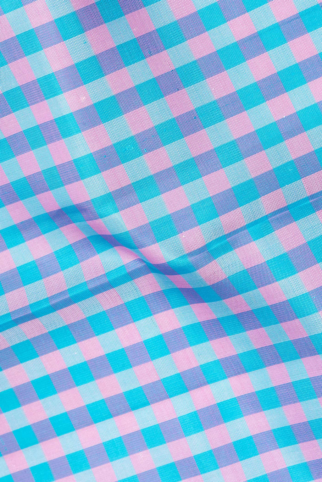 Close up of Pure Silk Multi Color Kanjivaram Saree with Checked design on the body and Zari Border.  displaying folds