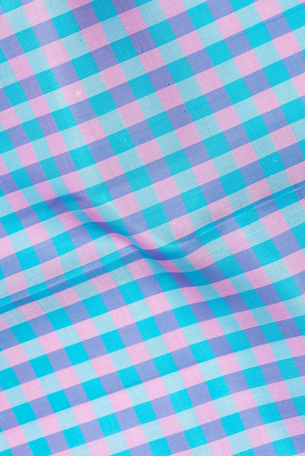 Close up of Pure Silk Multi Color Kanjivaram Saree with Checked design on the body and Zari Border.  displaying folds