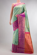 Sea Green Dual Tone Kanchipuram Tissue Saree with Zari Brocade on the body and Fancy Border.  displayed on a mannequin