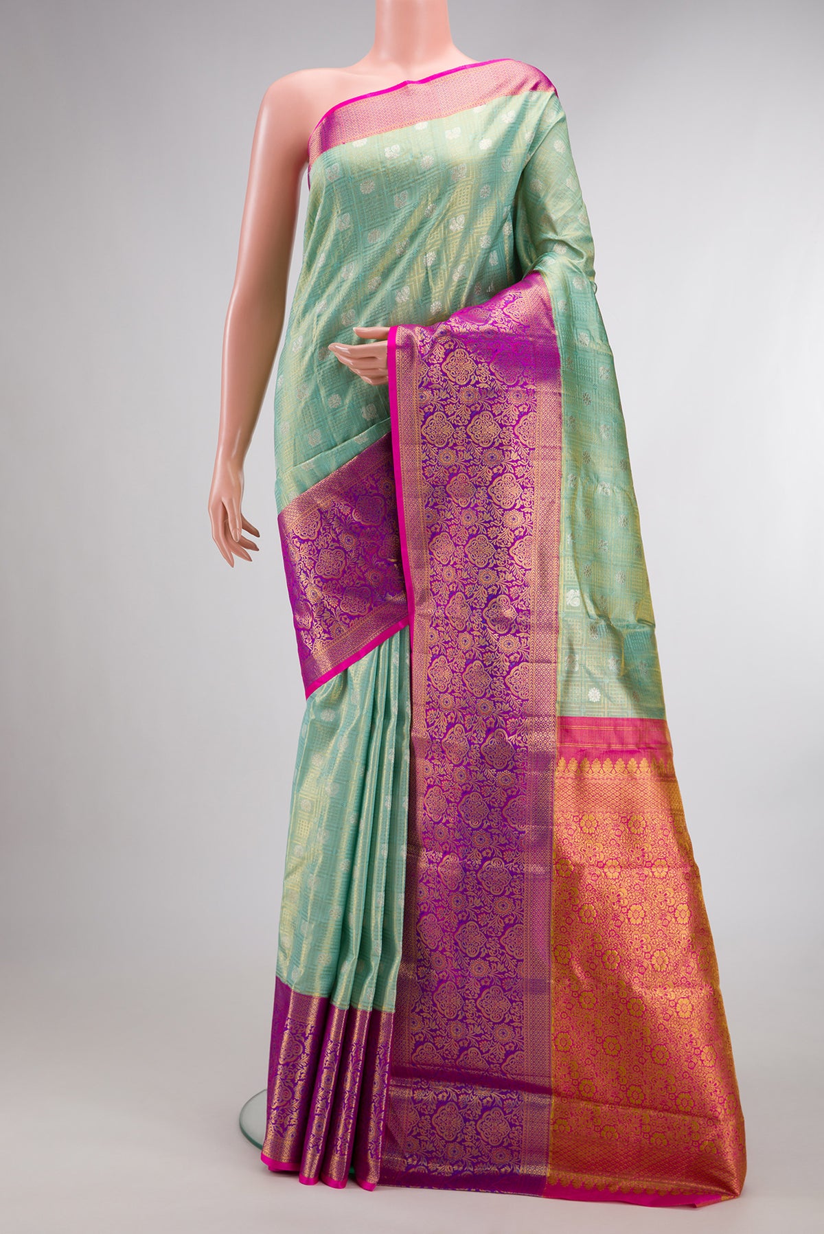 Sea Green Dual Tone Kanchipuram Tissue Saree with Zari Brocade on the body and Fancy Border.  displayed on a mannequin