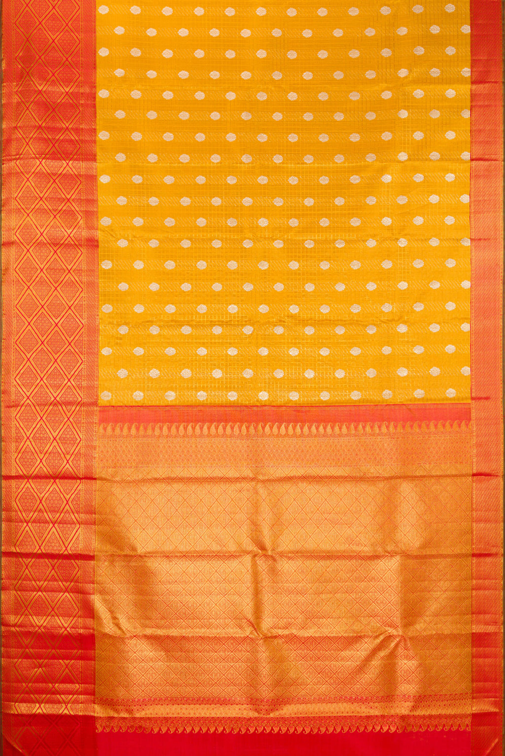Flat view of Mustard Kanchipuram Tissue Saree with Zari Brocade on the body and Fancy Border. 