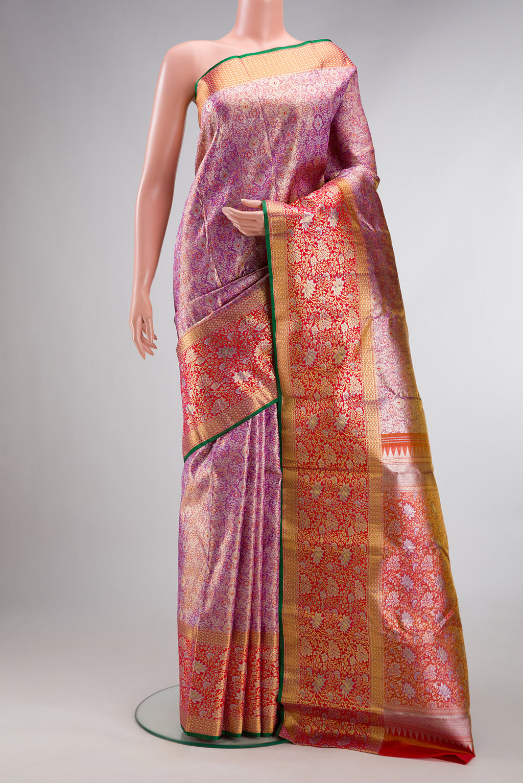 Pure Silk Pure Zari Purple Dual Tone Kanchipuram Tissue Saree with Zari Brocade on the body and Zari Border.  displayed on a mannequin