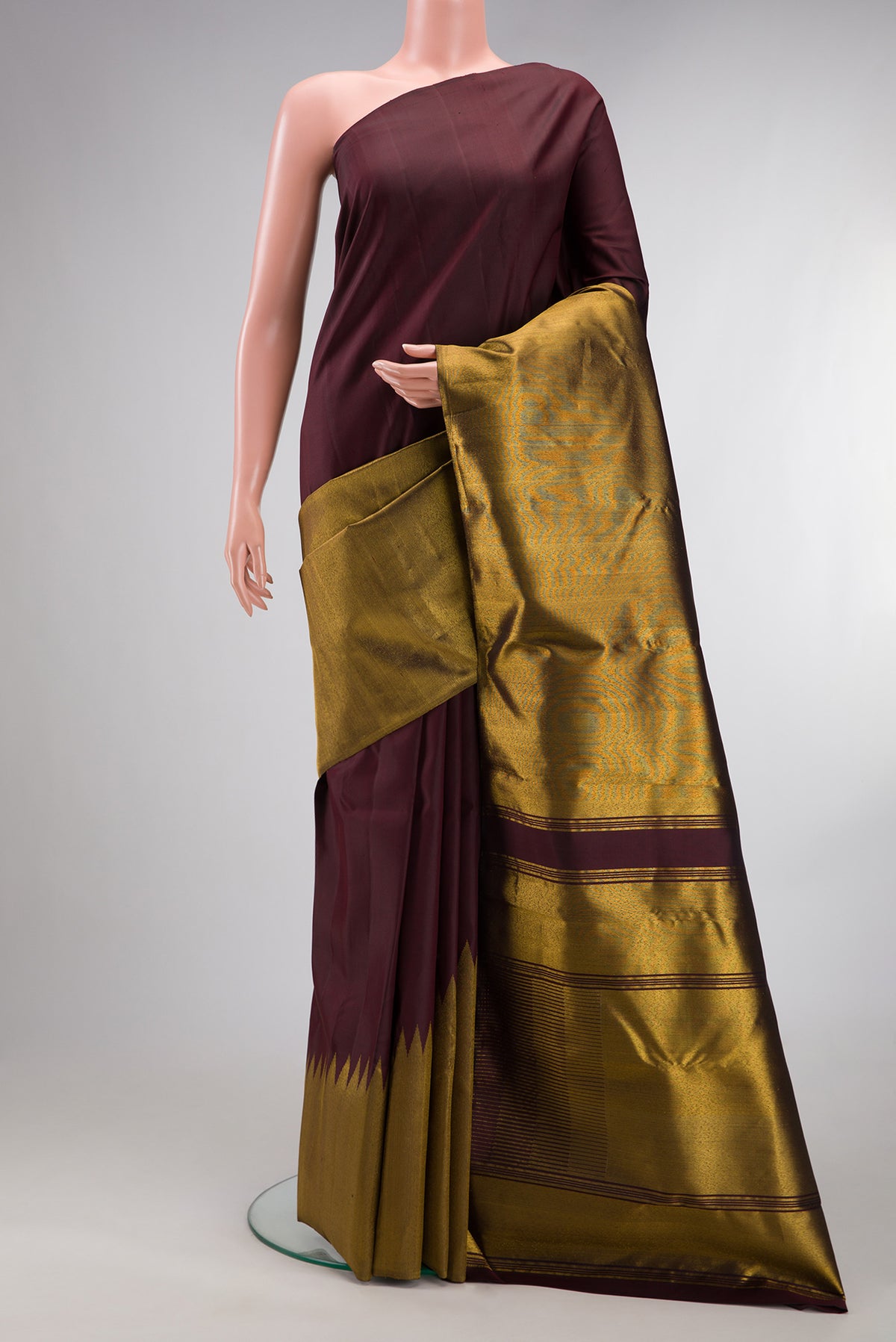 Pure Silk Coffee Brown Dual Tone Kanjivaram Saree with Plain Body and Rising Temple Border.  displayed on a mannequin