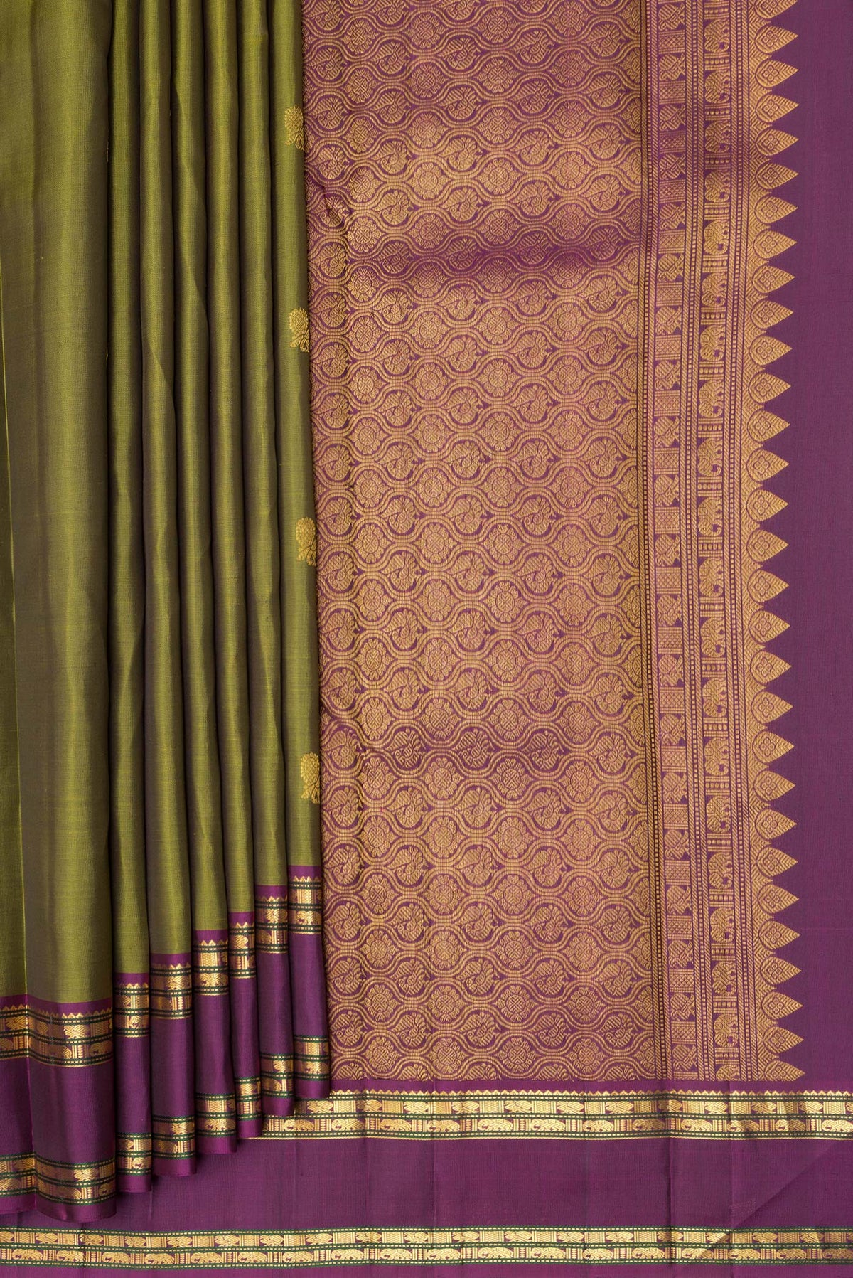 Pleats and pallu of Pure Silk Mehandi Green Kanjivaram Saree with Zari Butta on the body and Zari Border. 