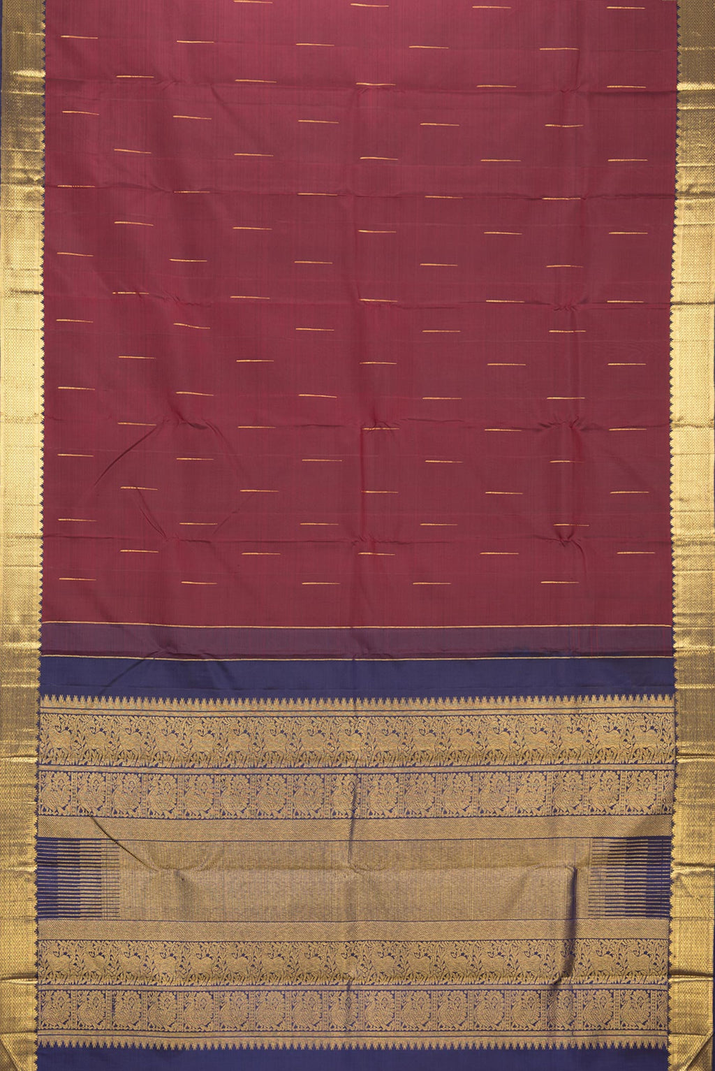 Flat view of Pure Silk Maroon Kanjivaram Saree with Zari Butta on the body and Zari Border. 