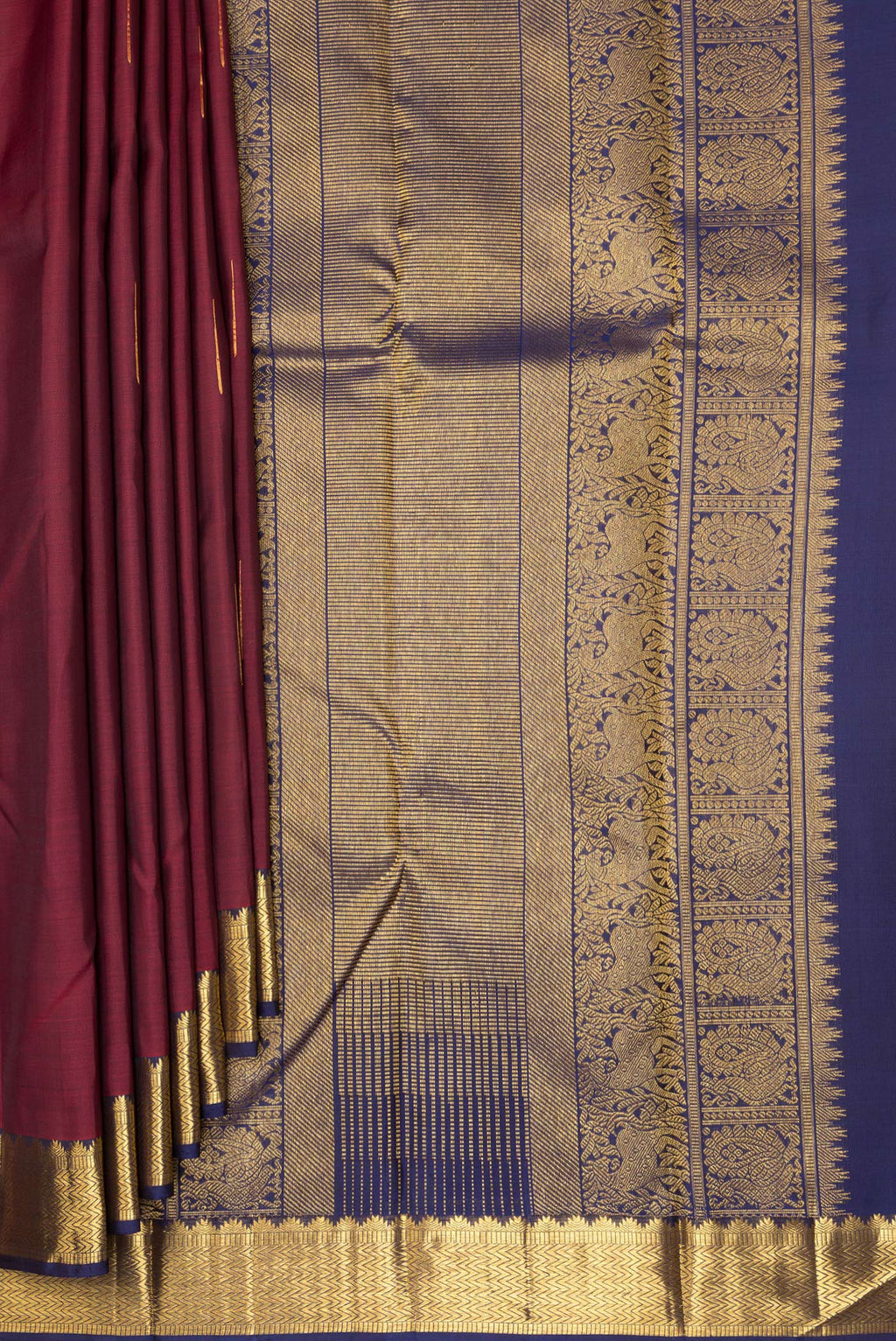 Pleats and pallu of Pure Silk Maroon Kanjivaram Saree with Zari Butta on the body and Zari Border. 