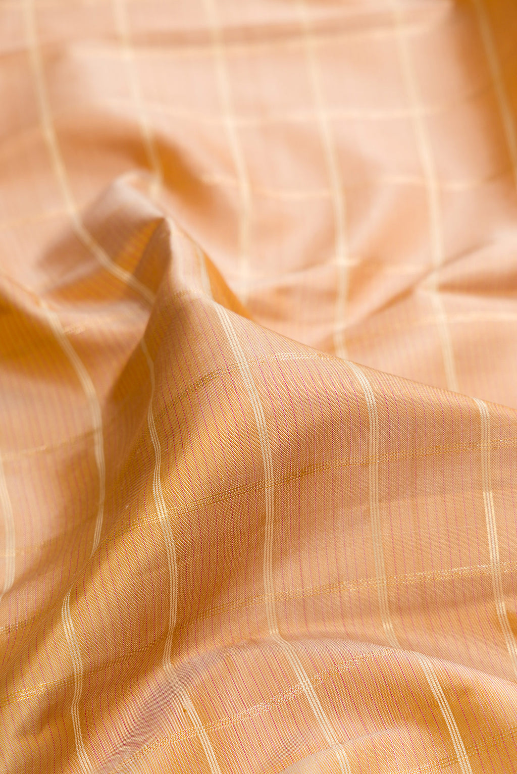 Close up of Pure Silk Sandal Kanjivaram Saree with Checked design on the body and Zari Border.  displaying folds