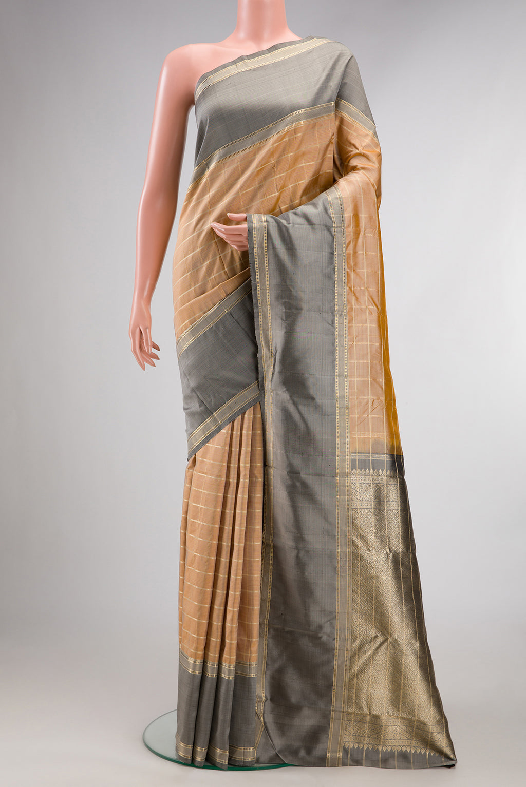 Pure Silk Sandal Kanjivaram Saree with Checked design on the body and Zari Border.  displayed on a mannequin