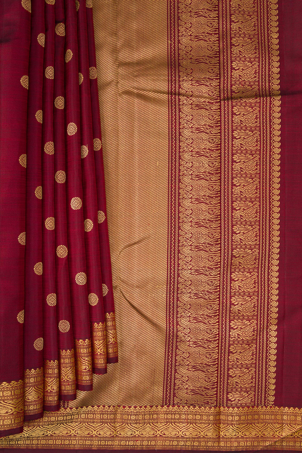 Pleats and pallu of Pure Silk Maroon Kanjivaram Saree with Thread Butta on the body and Thread Border. 