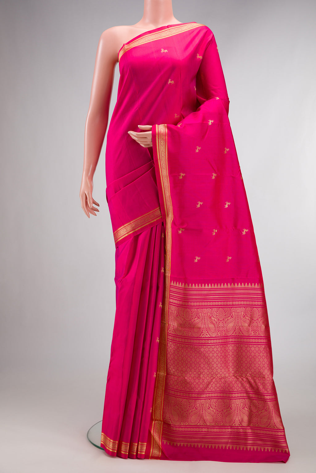 Pure Silk Pink Kanchipuram Saree with Thread Butta on the body and Thread Border.  displayed on a mannequin