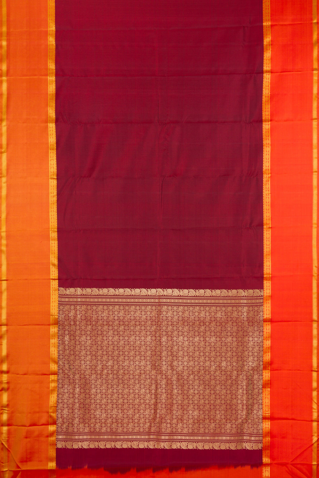 Flat view of Pure Silk Maroon Kanchipuram Saree with Plain Body and Ganga Jamuna Border. 