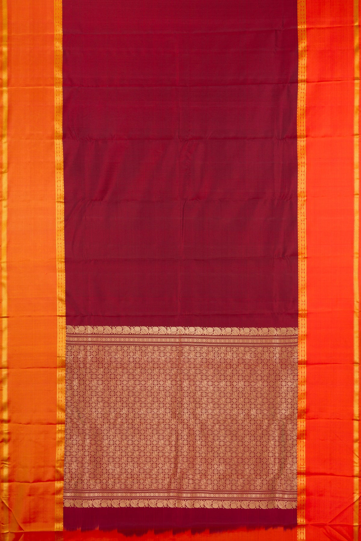 Flat view of Pure Silk Maroon Kanchipuram Saree with Plain Body and Ganga Jamuna Border. 
