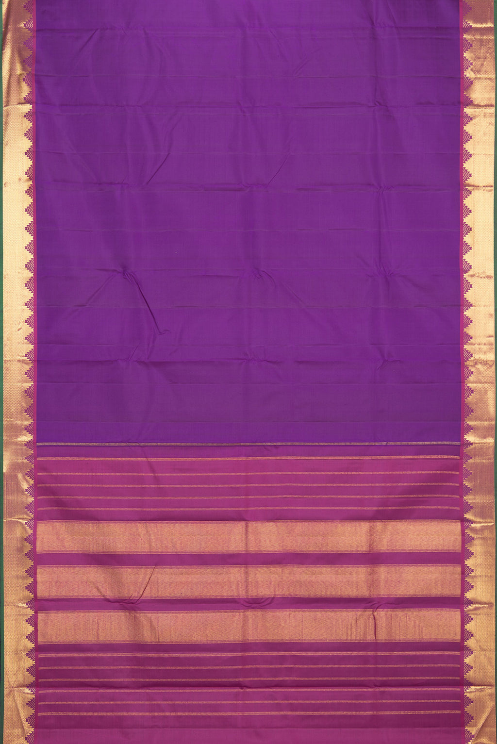Flat view of Pure Silk Purple Kanchipuram Saree with Plain Body and Zari Border. 