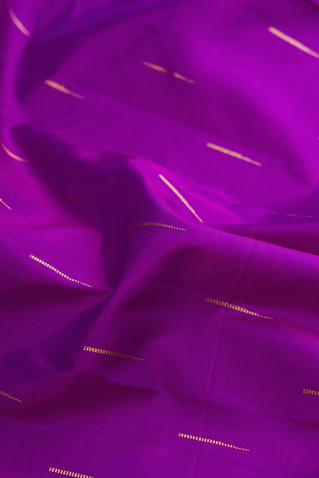 Close up of Pure Silk Purple Kanchipuram Saree with Zari Butta on the body and Zari Border.  displaying folds