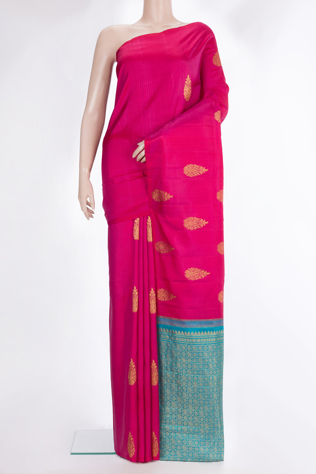 Pure Silk Dark Pink Kanchipuram Saree with Zari Butta on the body and Without Border.  displayed on a mannequin