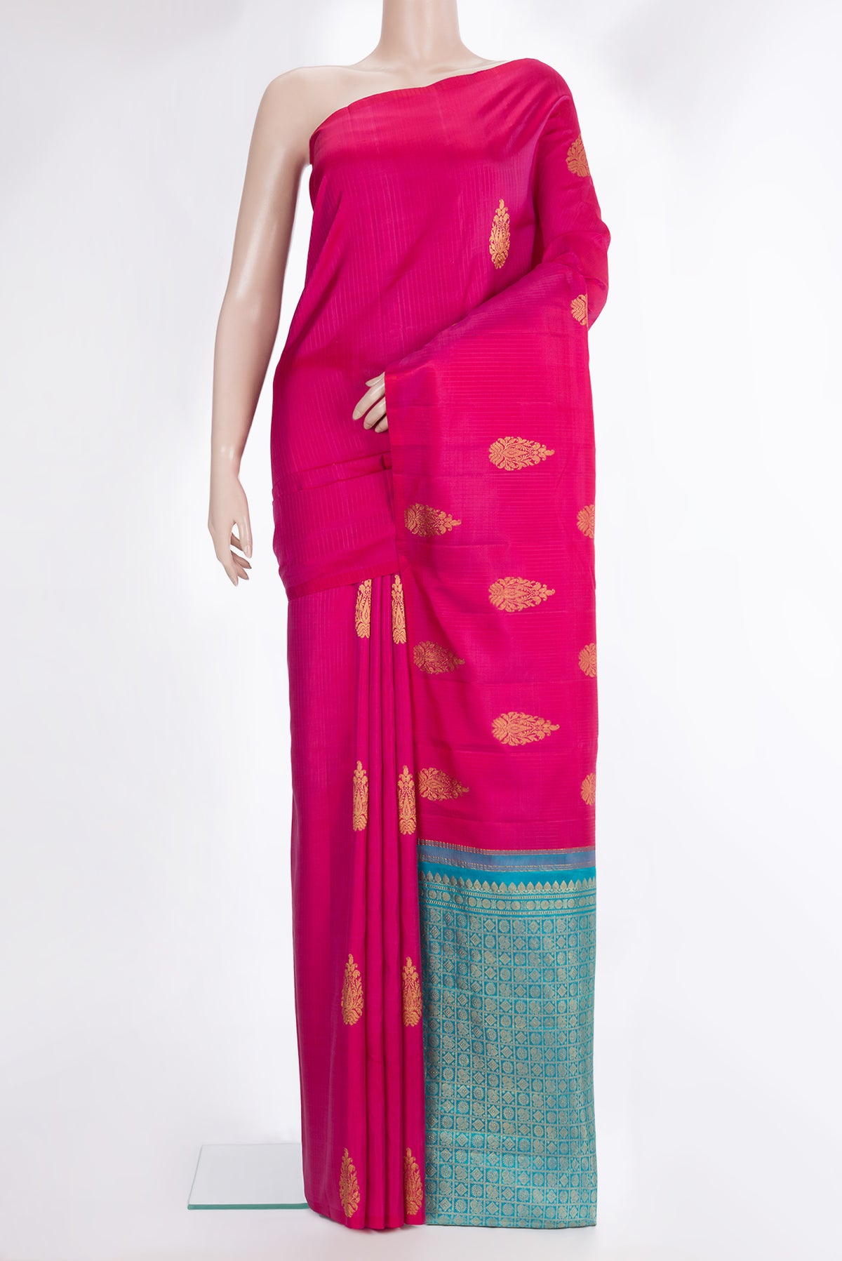 Pure Silk Dark Pink Kanchipuram Saree with Zari Butta on the body and Without Border.  displayed on a mannequin