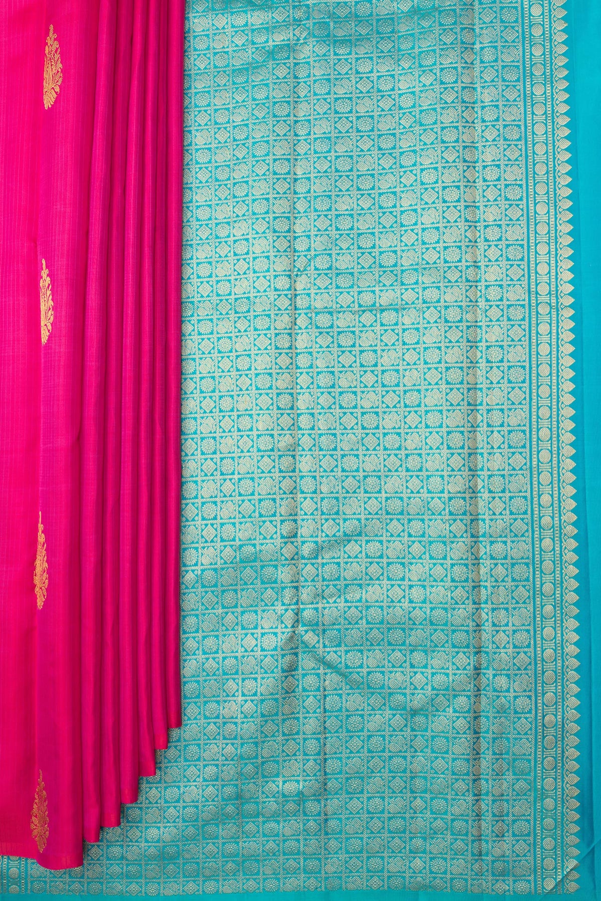 Pleats and pallu of Pure Silk Dark Pink Kanchipuram Saree with Zari Butta on the body and Without Border. 